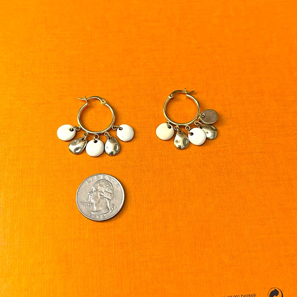 Circle earrings with five dangling pieces. Gold and white.